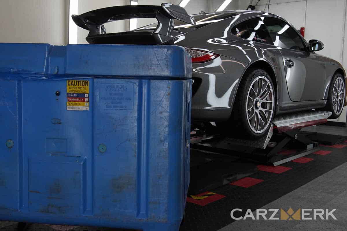 500lb Blue Dry ice bin next to Porsche 997.2 GT3 in Meteor Grey