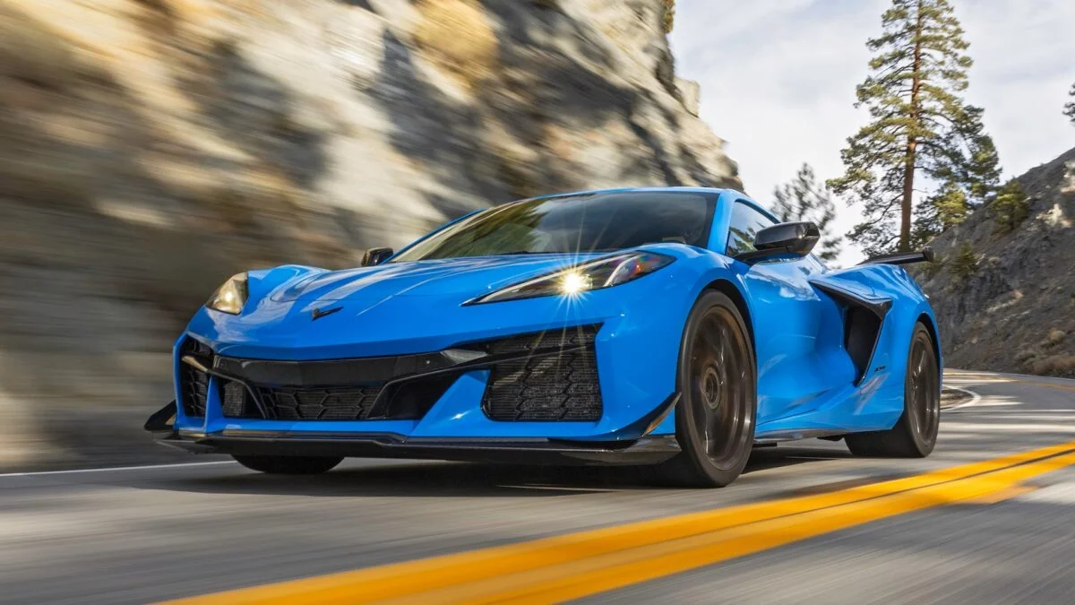 2023 Chevrolet Corvette Z06 driving on a road at the bottom of a cliff.