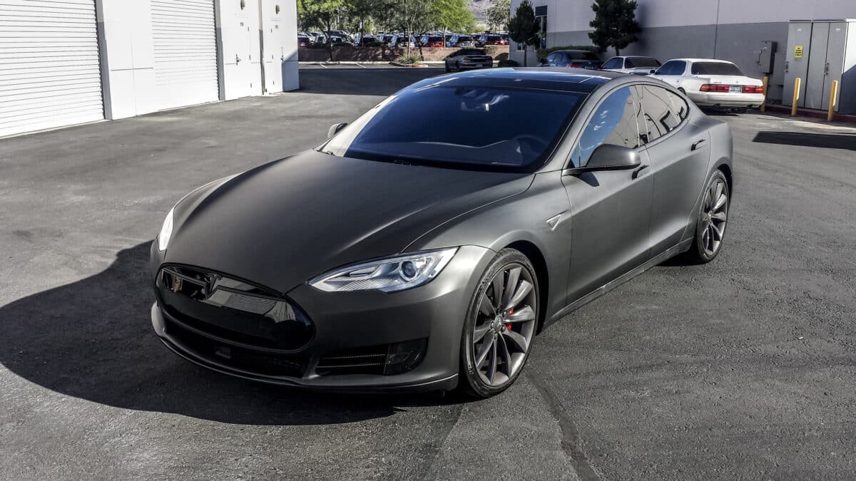 Matte Black Tesla Model S parked outside on a car lot.