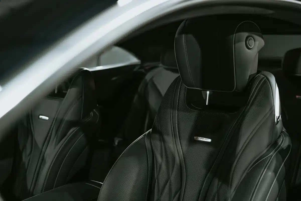 A clean black interior of a vehicle after interior luxury car detailing was performed in the Bay Area by Carzwerk.