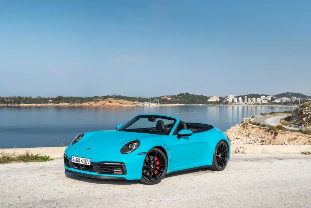 Miami Blue Porsche exterior colors on full display as it is parked outside on a sunny day.