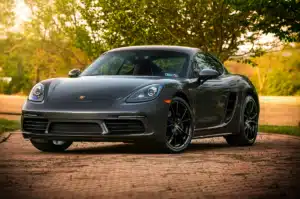 A matte black porsche that needs luxury car repair twice a year.