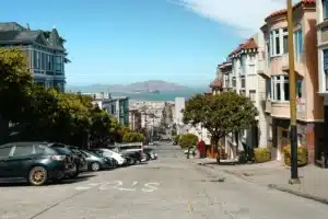 A street in San Francisco where cars are parked in the sun, under strong UV rays. This is why car detailing California is necessary.