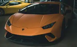 A bright orange exotic car. 