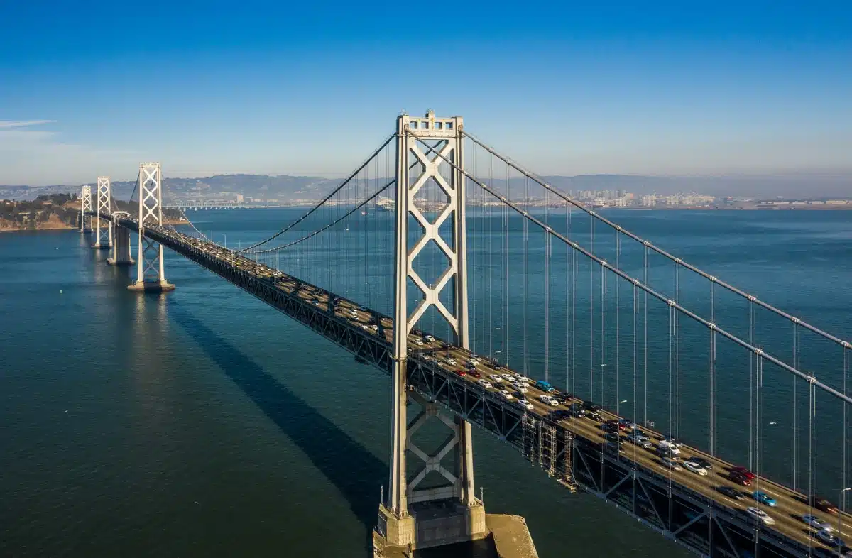 Golden Gate Bridge in San Francisco on a sunny blue sky day. Many cars on this bridge will receive Bay Area Auto Detailing at least once.